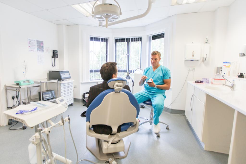 Dr. Eben van der Walt with a patient at Portmore Dental